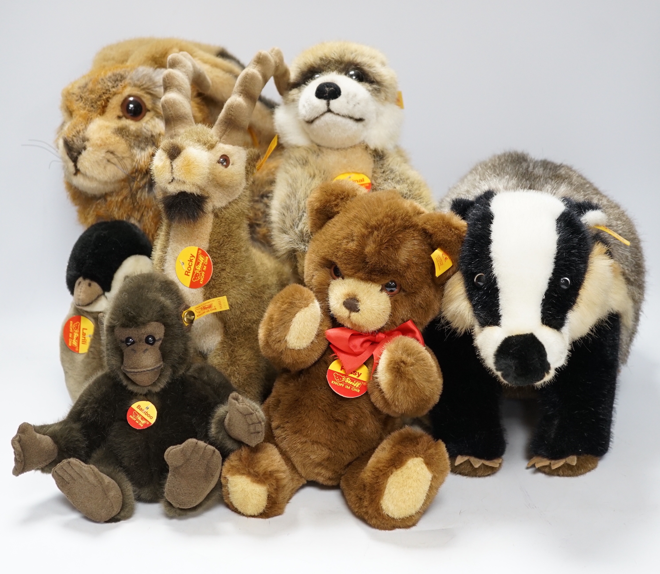 Seven Steiff animals, yellow tag: bear, Sigi badger, Rocky, Muneeb hare, Meerkat and others